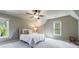 Spacious bedroom featuring two large windows providing abundant natural light at 10830 Carrara Cv, Alpharetta, GA 30022