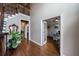 Staircase with hardwood floors, iron railings leading to an office space at 10830 Carrara Cv, Alpharetta, GA 30022