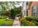 Charming brick home featuring manicured landscaping and a brick pathway leading to the entrance at 10830 Carrara Cv, Alpharetta, GA 30022