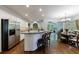 Bright kitchen with stainless steel appliances, breakfast bar, and adjacent dining area at 10830 Carrara Cv, Alpharetta, GA 30022