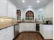 Kitchen with granite countertops, stainless steel appliances, and custom white cabinetry at 10830 Carrara Cv, Alpharetta, GA 30022