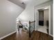 Landing featuring hardwood floors, staircase, and laundry room at 10830 Carrara Cv, Alpharetta, GA 30022