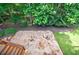 Stone patio overlooking lush greenery, offering an ideal outdoor retreat at 10830 Carrara Cv, Alpharetta, GA 30022