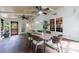 Elegant screened porch with ceiling fans and a dining table for outdoor entertaining at 10830 Carrara Cv, Alpharetta, GA 30022