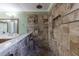 Tile shower with a rain shower head, a hand held and a tile bench at 10830 Carrara Cv, Alpharetta, GA 30022