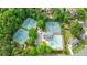 An aerial view showcasing tennis courts, swimming pool and clubhouse, close to the neighborhood at 10830 Carrara Cv, Alpharetta, GA 30022