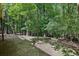 A serene, wooded backyard offering privacy and a natural setting at 110 Westchester Way, Alpharetta, GA 30005