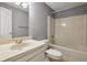 Cozy bathroom featuring a vanity with ample counter space and a combined tub and shower with neutral finishes at 110 Westchester Way, Alpharetta, GA 30005