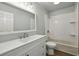 Clean bathroom featuring a large mirror, vanity with drawers, and a tiled shower-tub combination at 110 Westchester Way, Alpharetta, GA 30005