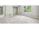Comfortable bedroom featuring plush carpeting, a closet, and a window with ample natural light at 110 Westchester Way, Alpharetta, GA 30005