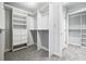 Walk-in closet with custom shelving and ample storage space for clothes and accessories at 110 Westchester Way, Alpharetta, GA 30005