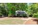 Beautiful home nestled on a spacious lot surrounded by mature trees offering both privacy and a serene setting at 110 Westchester Way, Alpharetta, GA 30005