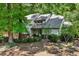 A lovely home with tidy landscaping, mature trees, and a well-manicured lawn at 110 Westchester Way, Alpharetta, GA 30005