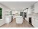 Well-lit kitchen with white cabinetry, stainless steel appliances, and a center island at 110 Westchester Way, Alpharetta, GA 30005