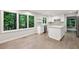 Bright kitchen featuring white cabinets, stainless steel appliances, and modern backsplash at 110 Westchester Way, Alpharetta, GA 30005