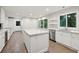Bright kitchen features a large island, stainless steel appliances, and plenty of counter space at 110 Westchester Way, Alpharetta, GA 30005