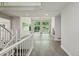 Open living room featuring tile flooring, a fireplace, and access to the outdoor deck through large windows at 110 Westchester Way, Alpharetta, GA 30005