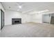 Spacious living area with modern fireplace and sliding doors, providing abundant natural light and comfort at 110 Westchester Way, Alpharetta, GA 30005