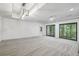 Open living room with recessed lighting, ceiling fan, sliding glass doors that bring the outdoors in at 110 Westchester Way, Alpharetta, GA 30005
