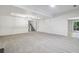 Large living area with recessed lighting, easy access to the staircase and sliding glass doors at 110 Westchester Way, Alpharetta, GA 30005