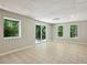 Bright living area with tile floors, recessed lighting and a sliding glass door with backyard views at 110 Westchester Way, Alpharetta, GA 30005