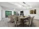 Cozy living and dining area with modern decor, fireplace, and large windows at 110 Westchester Way, Alpharetta, GA 30005