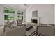 Bright living room featuring large windows with natural light, fireplace, and neutral décor at 110 Westchester Way, Alpharetta, GA 30005