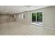 Living area featuring tile flooring, recessed lights, a bar area and a sliding door to the outside at 110 Westchester Way, Alpharetta, GA 30005