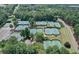 Aerial view of well maintained community tennis courts surrounded by mature trees at 110 Westchester Way, Alpharetta, GA 30005