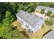 Aerial view of townhome featuring well-maintained landscaping and green surroundings at 2566 Walden Lake Dr, Decatur, GA 30035