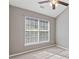Bedroom with a large window with white blinds, a ceiling fan, and neutral color scheme at 2566 Walden Lake Dr, Decatur, GA 30035