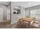 Dining area with light wood table, seating for six, and partial view of the kitchen at 2566 Walden Lake Dr, Decatur, GA 30035