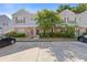 Townhouse complex featuring brick and siding exteriors with ample parking space at 2566 Walden Lake Dr, Decatur, GA 30035