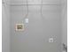 Neutral laundry room with wire shelving, utility connections, and gray walls at 2566 Walden Lake Dr, Decatur, GA 30035