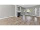 Spacious living room with fireplace, large windows, and hardwood floors at 2566 Walden Lake Dr, Decatur, GA 30035