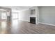 Open-concept living area featuring a fireplace, hardwood floors, and ample natural light at 2566 Walden Lake Dr, Decatur, GA 30035