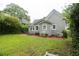Backyard featuring a well-maintained lawn, patio area, and mature trees at 1096 Tilden Nw St, Atlanta, GA 30318