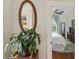 Bedroom entrance featuring hardwood floors and a view into the adjacent room, complemented by a stylish mirror at 1096 Tilden Nw St, Atlanta, GA 30318