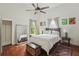 Bright bedroom featuring hardwood floors, a ceiling fan, and natural light at 1096 Tilden Nw St, Atlanta, GA 30318