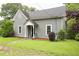Beautiful one-story home featuring a well-kept lawn and lovely front porch at 1096 Tilden Nw St, Atlanta, GA 30318