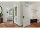 Hallway showing access to the bedroom and bathroom with a clawfoot tub, highlighting the home's layout and charm at 1096 Tilden Nw St, Atlanta, GA 30318