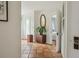 Hallway featuring classic tile flooring, neutral walls, and doorways leading to various rooms in the house at 1096 Tilden Nw St, Atlanta, GA 30318