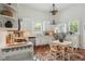 Bright kitchen features white cabinets, stainless steel appliances, and an adjacent dining area at 1096 Tilden Nw St, Atlanta, GA 30318