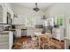 Bright kitchen with white cabinets, stainless steel appliances, and a cozy dining area at 1096 Tilden Nw St, Atlanta, GA 30318
