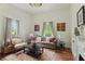 Cozy living room featuring hardwood floors, large windows, and a comfortable seating arrangement at 1096 Tilden Nw St, Atlanta, GA 30318