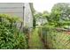 Side yard with metal fence separating the property at 1096 Tilden Nw St, Atlanta, GA 30318