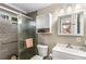 Modern bathroom featuring a tiled shower with glass door, modern cabinets, and decorative tile accents at 1990 Wellbourne Dr # 5, Atlanta, GA 30324