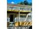 Exterior view of the building showing two levels of balconies with white railings at 1990 Wellbourne Dr # 5, Atlanta, GA 30324