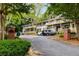 A quiet neighborhood entrance surrounded by lush trees and shrubbery leading to this lovely building at 1990 Wellbourne Dr # 5, Atlanta, GA 30324
