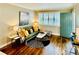 Comfortable living room with large windows, a cozy couch, and a stylish area rug at 1990 Wellbourne Dr # 5, Atlanta, GA 30324